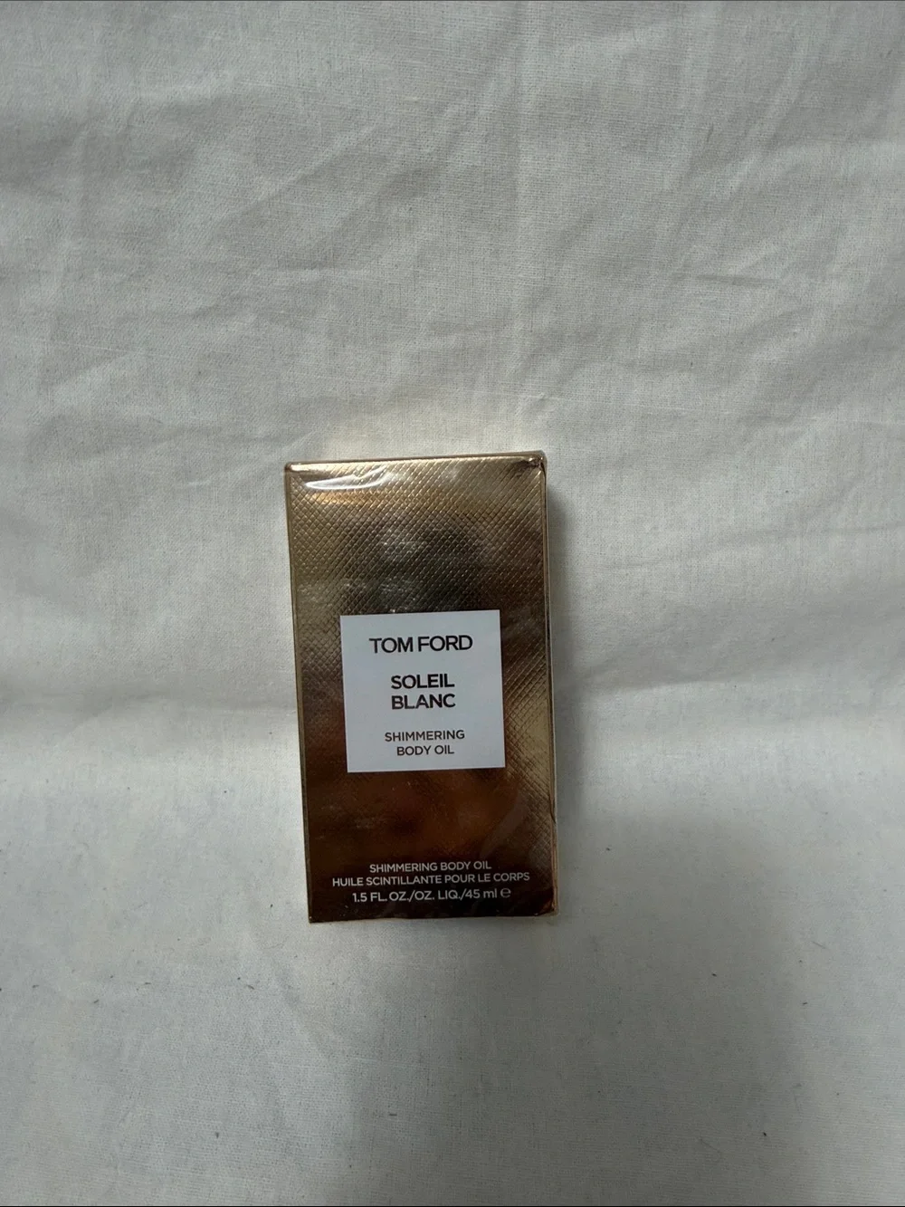 Tom Ford Shimmering Body Oil in Metallic Gold Packaging